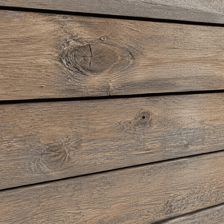 Woodtone RusticSeries lap siding in a weathered driftwood-brown woodgrain finish