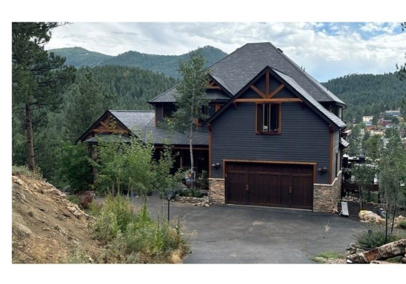 F-Wave REVIA Designer Slate roof in black on a foothills home surrounded by forest in Evergreen, Colorado