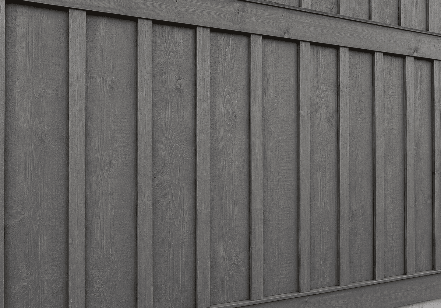 Woodtone RusticSeries board and batten siding in Cascade Slate, a slate-gray woodgrain finish